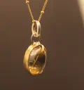 The Golden Illuminator: Rutile Quartz Pendant