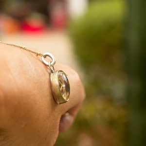 The Golden Illuminator: Rutile Quartz Pendant