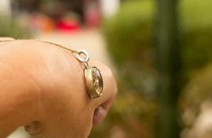 The Golden Illuminator: Rutile Quartz Pendant